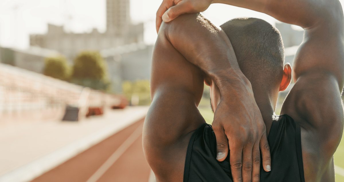 Palm Beach orthopedist assessing shoulder range of motion in a patient with frozen shoulder