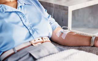 Patient receiving a physician-supervised IV infusion at an orthopedic practice in Delray Beach, Florida