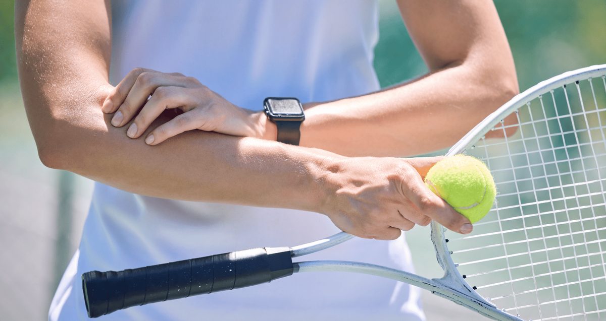 Orthopedic provider applying shockwave therapy to a patient's tendon in a Delray Beach office